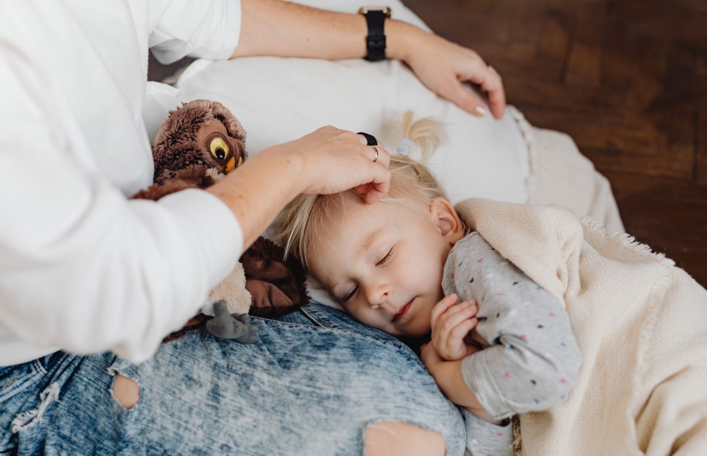 Picture of a child being cuddled from the mother